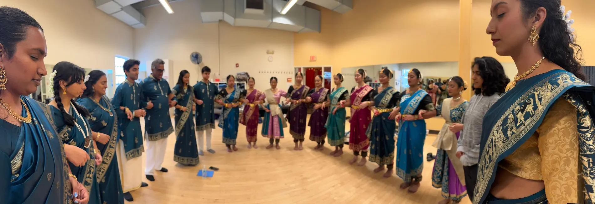 Nootana artists gathered in a circle during rehearsal